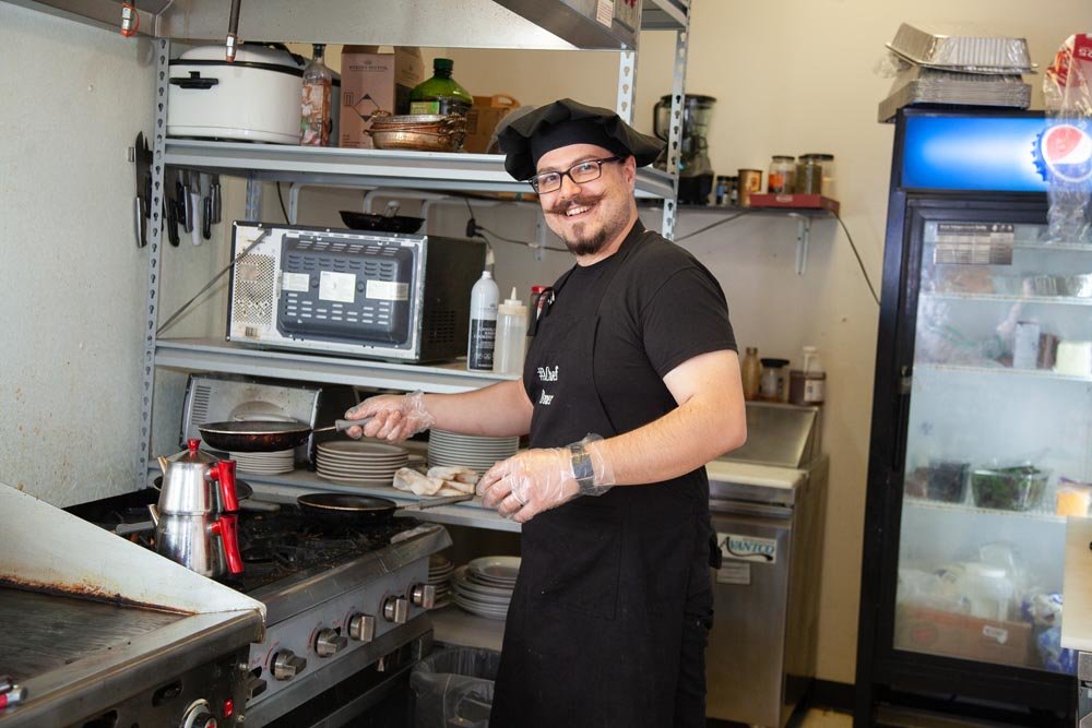 HEAD CHEF: Omer Onder frequently works solo in the kitchen at Springfield Diner.